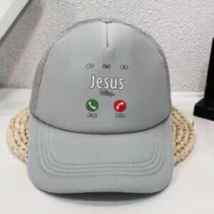 Grey cap Unisex with " Jesus is calling " on the front .